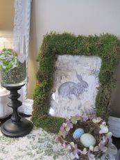 Well, it has a picture of a rabbit as well as a bird's nest in the corner. Also, I don't think the moss is real. Well, it better not be real or that might be a problem.