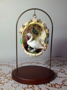 I know this was probably made from some company and is being sold as a collectible. But I love how it's covered in roses and painted inside with butterflies.