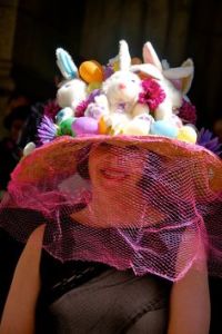 I don't know about you, but she looks as if she's wearing a wide brimmed beekeeper hat of some sort. Not sure why.