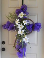 Now this is a lovely cross to hang on your front door. And it's even better because it's purple as well as has flowers.