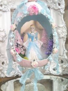 This is a lovely egg that's decorated with flowers and ribbons. Wish they had one for Beauty and the Beast.