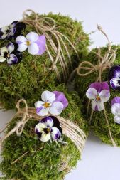 This seems like an interesting idea. And the purple pansies are tied with string. Great for any table large or small.