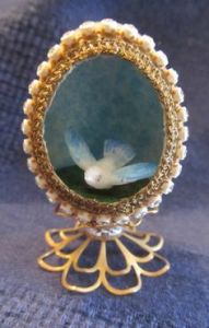 This is a lovely little egg with just cute bird. Love the outside of this, too.