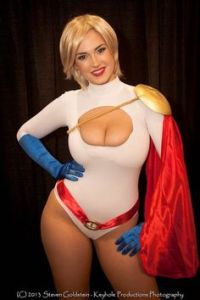Super abilities include super strength, flight, heat vision, and significant cleavage. However, she refuses to be acknowledged as a derivative to Superman since she's her own woman.