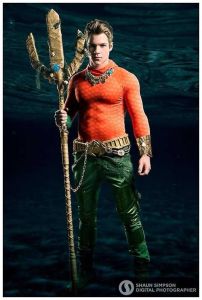 I'm not very familiar with Aquaman either. Still, he's said to be adapted to surviving in the sea and communicate with marine life.