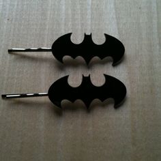 They're just bobbie pins with the bat symbol on them. Not sure if Batgirl would wear them though.