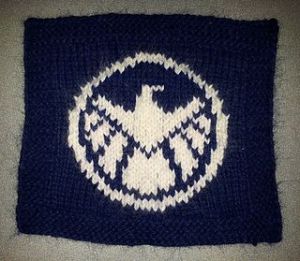 Sure S.H.I.E.L.D. is supposed to be a secret government organization. Yet, it has its own insignia like MI-6 in James Bond. 