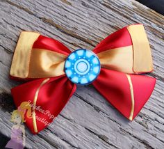 This one is gold and red with Tony Stark's radioactive heart. Which goes broke in the second film where he has to make a new element.