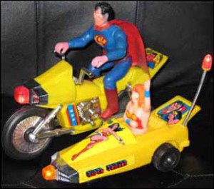 Uh, isn't Superman supposed to be faster than a speeding bullet? So why the hell would he need a motorcycle? Also, why does Wonder Woman have red hair?