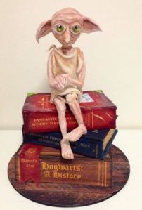 Dobby likes seeing a cake in his likeness. Dobby thinks the maker is too kind. Dobby is in tears.