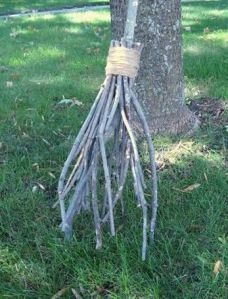This one just consists of wrapping twigs on big stick with packing tape. Seems doable if you ask me.