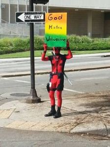 Sign says, "God Hates Wolverine." Best not to take him too seriously.