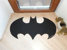 It's the kind of rug that welcomes friends and strikes fear into enemies. Like the bat sign in Gotham City.