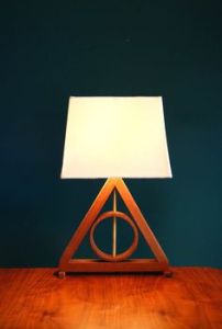 Shapes of the Deathly Hallows: The line symbolizes the Elder Wand, held by the brother who died lusting for power. The circle represents the Resurrection Stone held by the brother who died for love. And the Triangle represents the Invisibility Cloak held by the brother who hid away from Death for many years before greeting him as an old friend.