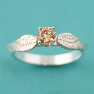 Guys, unless she insists on a ring like a golden snitch, don't get her one. Even if she likes Harry Potter. Also, costs $155.