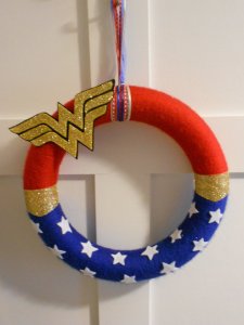This wreath contains stars and the Wonder Woman symbol. All in all it should be great for any home.