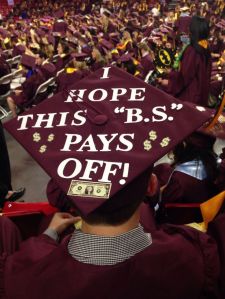 As you'll see, some grads decorate their caps in unique ways. I suppose "B.S." either stands for bullshit or Bachelor in Science.