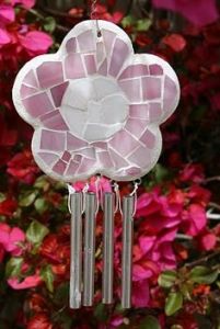 I'm sure the chimes are attached at the flower. But the flower is so beautiful.