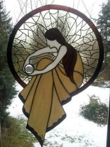 Or so it looks like a spider web. Wonder what she has in her hand. A raindrop?