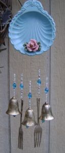 You tend to see a lot of cutlerly in wind chimes. Not sure if it enhances the aesthetic or brings out the sound.