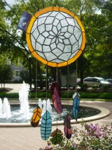 This dreamcatcher seems to bear some resemblance to a stained glass window. But it's a suncatcher.