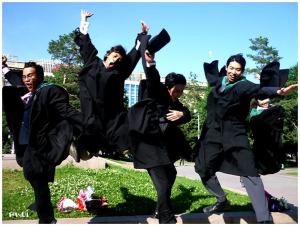 I think these guys are from China. Still, all seem to have their gown blowing with one jumping into the air.