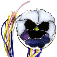 You might see a lot of pansies around. But I do like this purple one. The ribbons are a nice touch, too.