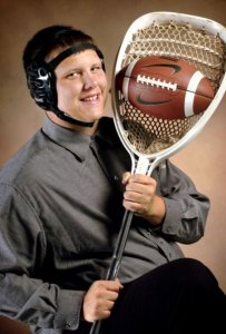 So this kid has wrestling gear, a football, and a lacrosse stick. Would be very interested to see what kind of sport he's in that uses these things. Oh wait, he's in football, wrestling, and lacrosse.