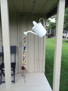 This one has beads coming out from a watering can. Not sure why the wire ends are there. Probably for decoration.