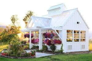 This one has a lovely flowers out front. But it seems to glimmer in the sunlight like a marble statue.