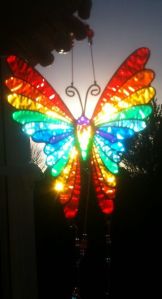 Yes, this is a rainbow butterfly suncatcher. And yes, it's in the sunlight. Amazing, isn't it?