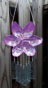 Not sure how it sounds when the wind blows. But this looks quite beautiful, especially since it's purple.