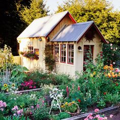 Well, I think this shed makes the garden seem more sunny. Love the window frames.