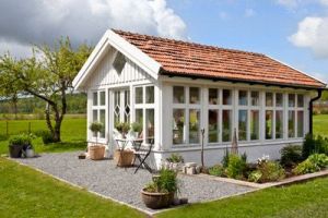 This is very beautiful, especially under the blue sky. Love the plants nearby.