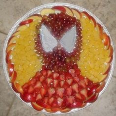 Yes, this fruit salad in the form of Spider Man. And it's filled with apple slices, pineapple, strawberries, and grapes.