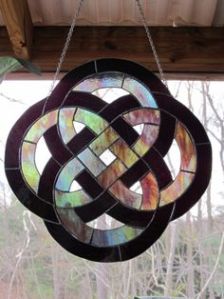 This one has rainbow glass surrounded by black. Very pretty though. So lovely.