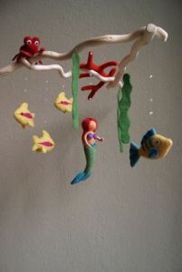 It's a good rendition of the Little Mermaid to hang from the ceiling. I can see Ariel, Flounder, and Sebastian on there, too.