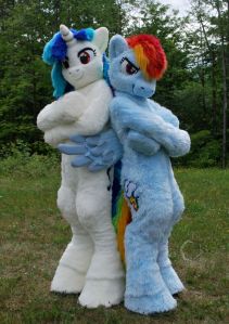 Not sure who the white and blue unicorn is. But the other one is Pinkie Pie. Sorry, but I'm not familiar with My Little Pony.
