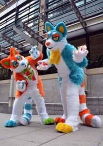 Because these two are in bright colors that you wouldn't see on most mammals in nature. Neon orange and bright blue, come on.
