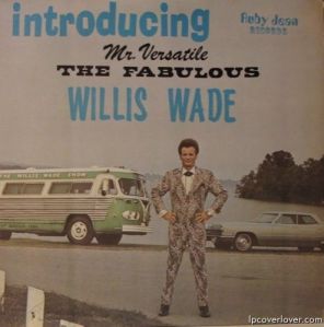 That has to be one of the most hideous suits I have ever seen. Those cars look pretty lame, too.