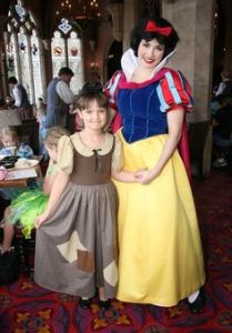 This little girl is dressed as Snow White in rags. And here she is with a Snow White at Disney. Seems so proud.