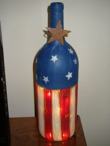 This old wine bottle is painted red, white, and blue. And it has something lighting up inside as well. Yes, it's quite amazing.
