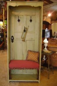 This one uses a door panel and long shutters. It also includes hooks and a cushioned bench.