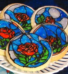 As you've seen the movie, the intro is told with stained glass windows and there's an enchanted rose involved. I'm sure these were professionally made as well.