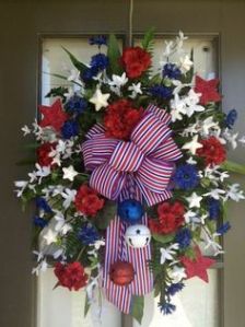 And it helps because it has red, white, and blue jingles that jangle. Love the flowers on this though. Very pretty.