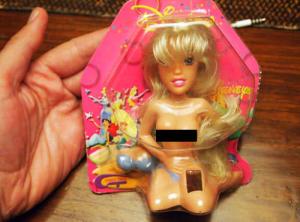 This has to be bootleg since this doll is practically naked. And I know Disney would never sell toys like that to young girls. Also has a Barbie doll head.