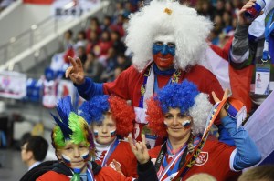 Here's a Russian family in their team spirit. All are donned in their ridiculous clown wigs and flag colors. The father even painted his face.