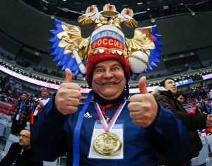 For some reason, I wonder if his hat was taken from a logo in a beer advertisement or something like that. However, I think it's the Russian national seal.