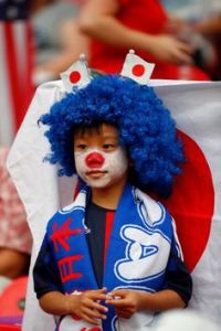 If he were an anime character, you wouldn't take it as anything out of the ordinary. Still, kind of reminds me of a child circus clown more than anything.