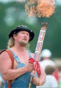 However, he also decided to dress in a way that's mocking his fellow country men earning at a significant lower income level. Also that torch is made from Bud Light beer cans.